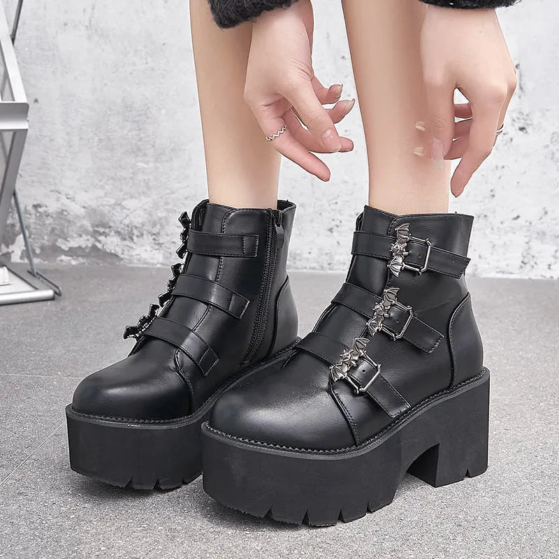 Black women's punk gothic Martin boots with bat buckle and side zip.