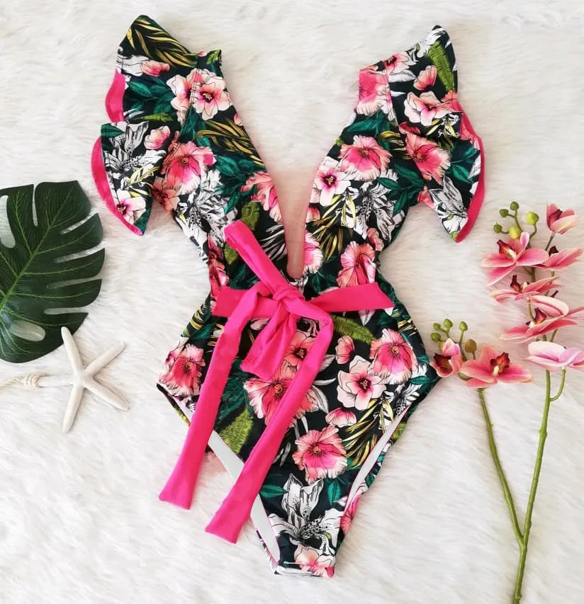 Blue printed one-piece swimsuit for women with one-shoulder ruffle and chest pad on white background