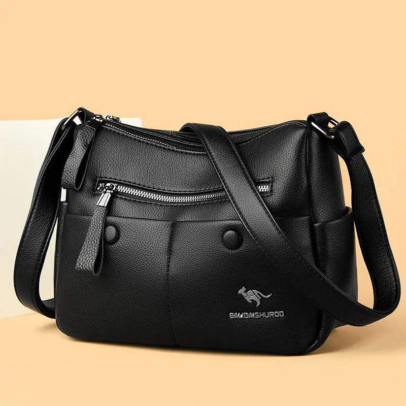 Soft PU leather women's crossbody shoulder bag in horizontal square shape with multiple internal pockets