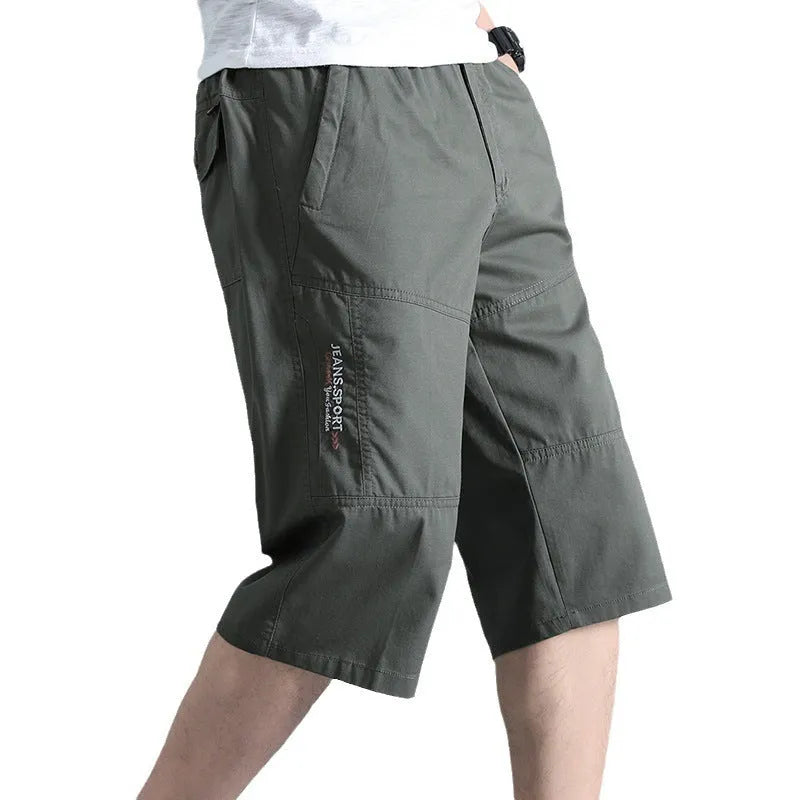 Men's straight-leg cotton sports pants in light grey showing cropped length and casual styling