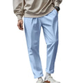 Men's loose fit drawstring trousers in solid colour Beige, side view showing straight leg and mid-waist drawstring closure.