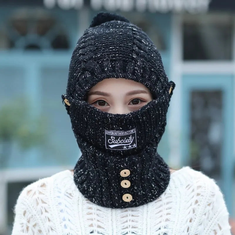 Wool fleece Lei Feng dome hat with ear flaps in navy blue, side view showing embroidered patch detail