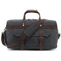Large black canvas crossbody travel bag with visible stitching, shown from the side.