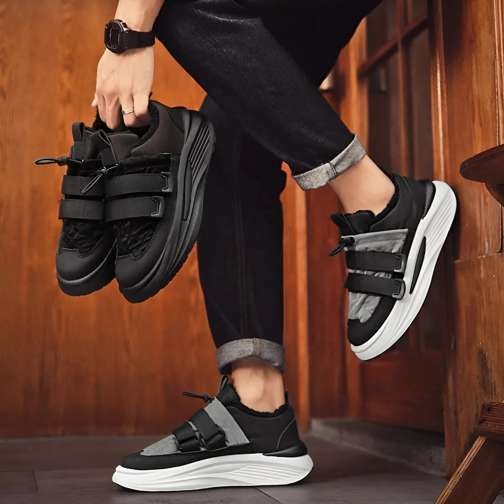 Men's black and gray striped lace-up platform sneakers with cotton upper and PVC sole on display