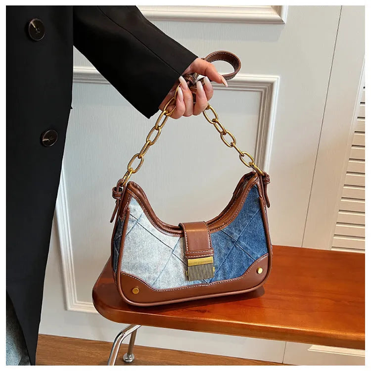 Brown soft denim women's shoulder bag with diamond mesh and chain details, showing bucket shape.