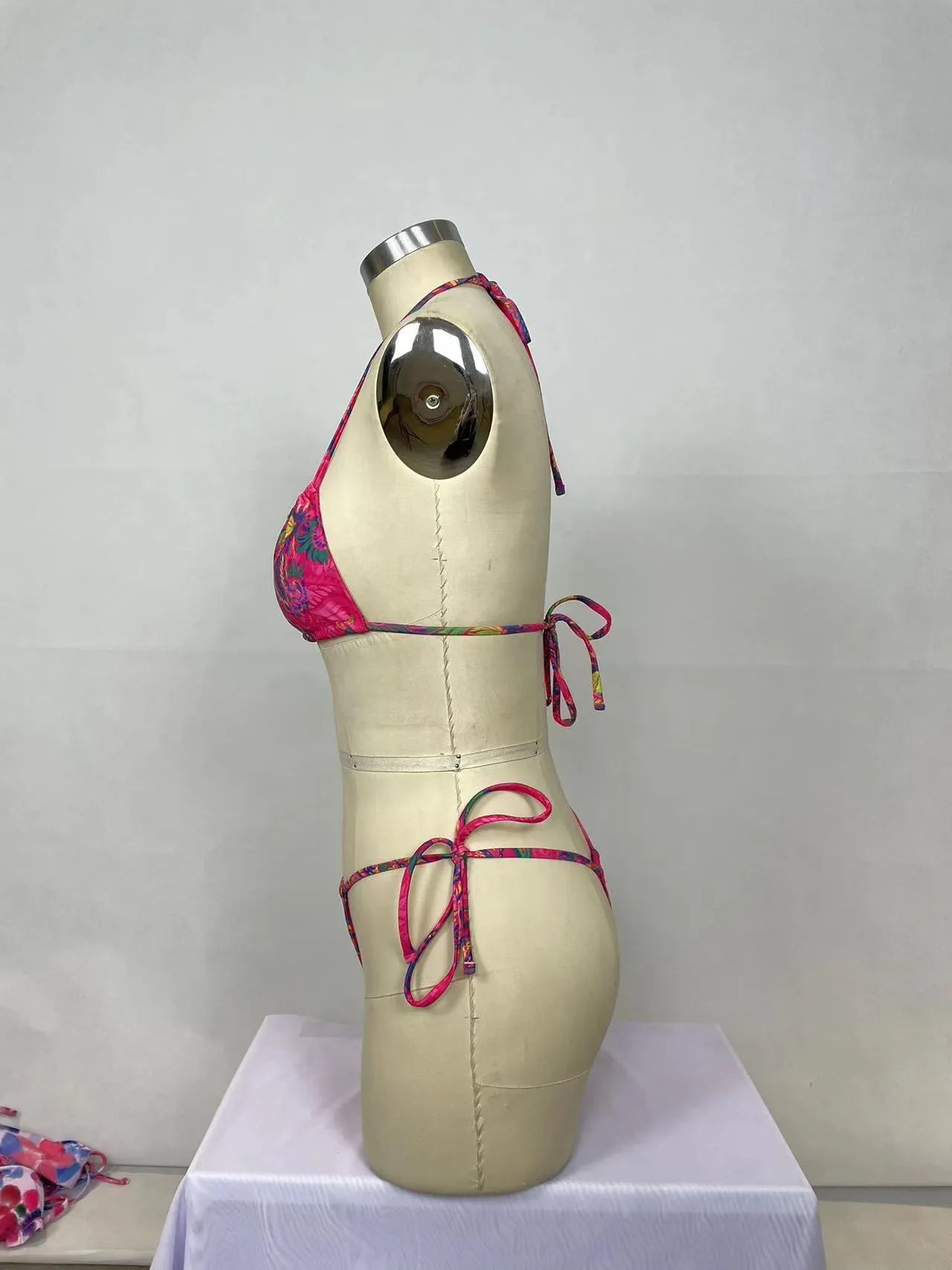 Pink printed women's bikini two-piece swimsuit set with sleeveless top and briefs
