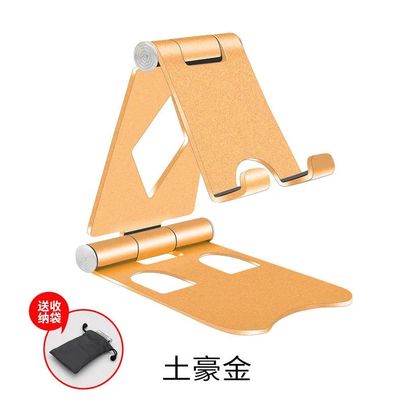 Aluminium alloy mobile desktop stand folding bracket in silver on a desk with a smartphone