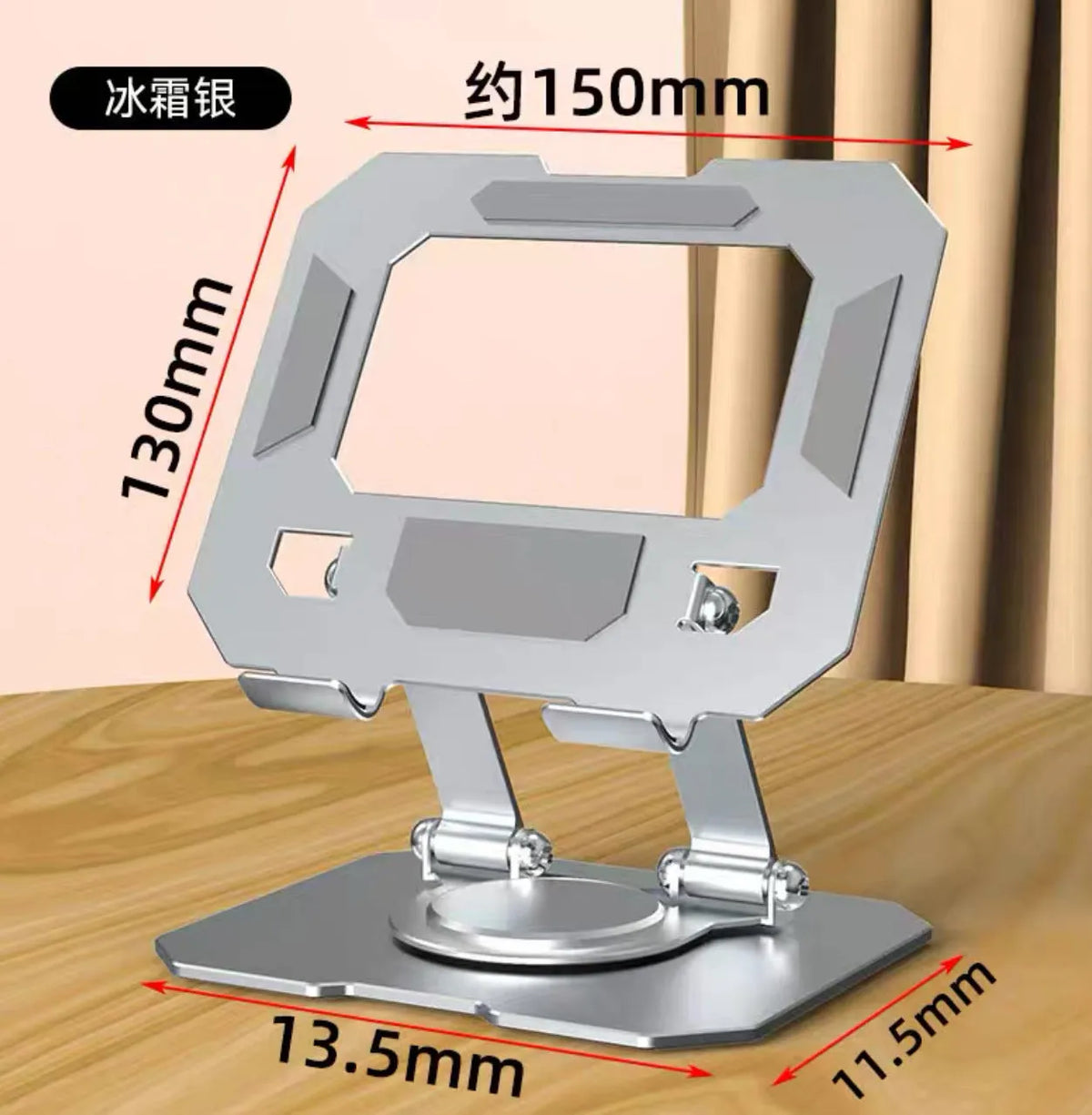 Black foldable laptop stand with metal grid design and height adjustment, placed on a desk with a laptop