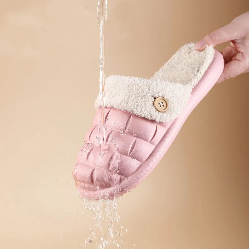 Plaid detachable EVA slippers with plush lining in pink, shown on a foot.