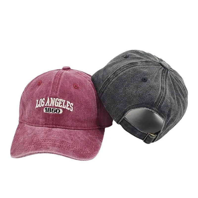 Retro personalised washed distressed peaked cap with adjustable strap and embroidered letters on the front.