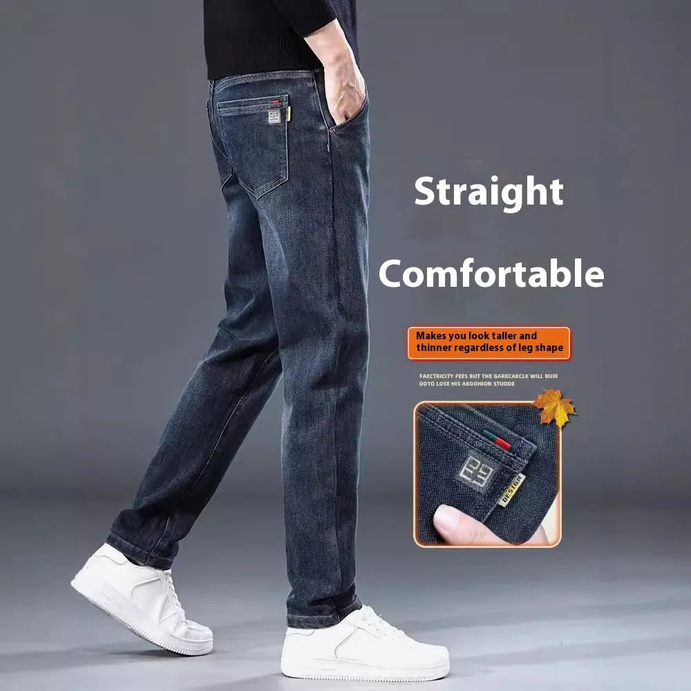 Man wearing slim straight blue grey casual trousers with a zipper fly and mid waist.