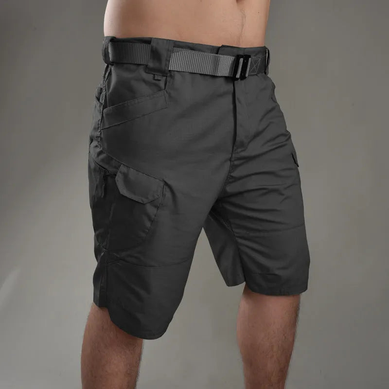IX7 men's tactical shorts in cotton blend fabric shown in a camouflage colour, featuring a button fly.