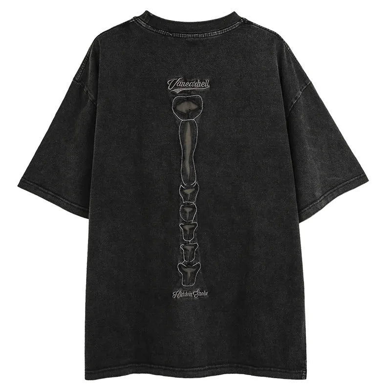Loose fit black cotton t-shirt with skull and letter print, featuring drop-shoulder short sleeves.