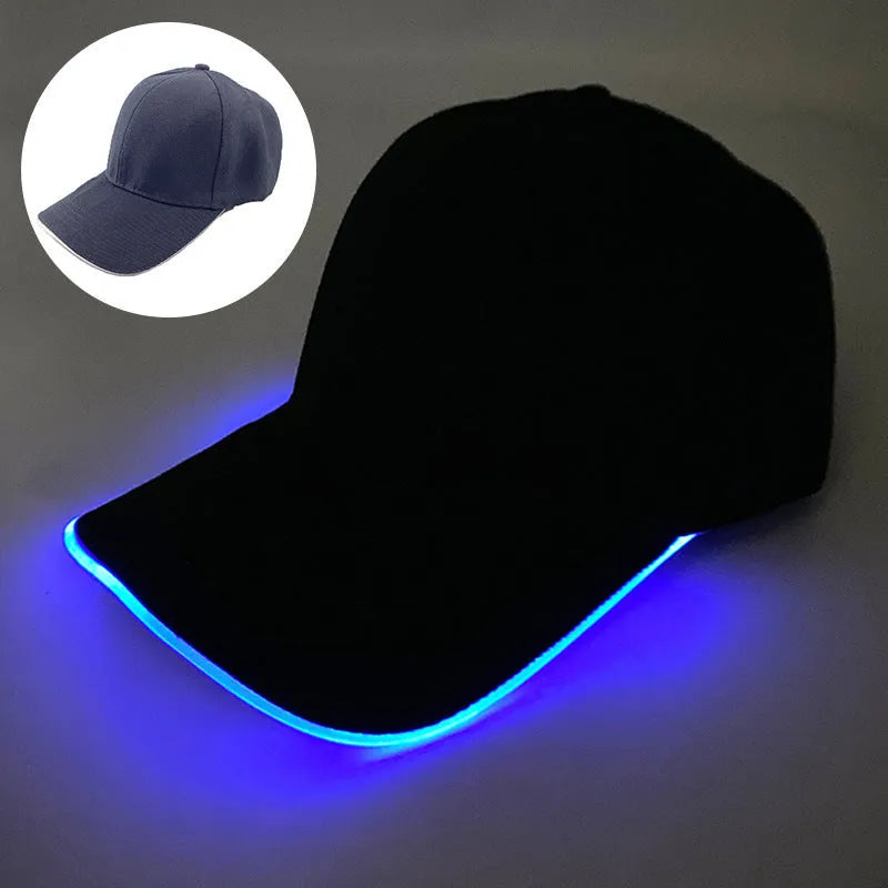 Black Halloween baseball cap with LED pumpkin smile face and yellow lights illuminated.