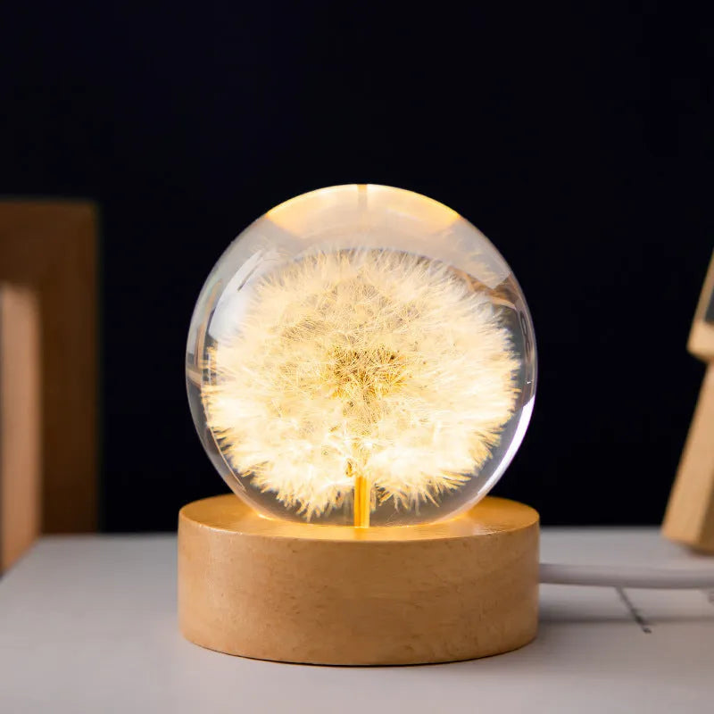 6cm clear resin dandelion crystal ball night light on a beech wood base with USB cable.