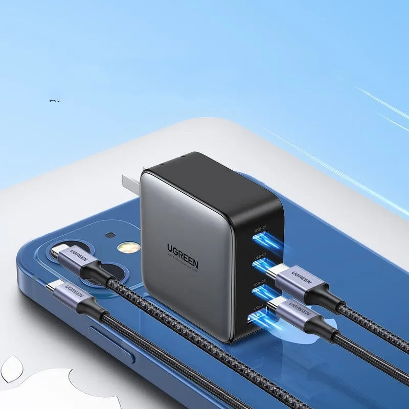 100W Gallium Nitride multi-port USB-C charger plug with attached cable on a grey background.