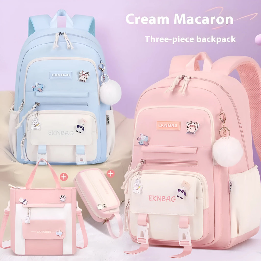 A girls' school backpack in Oxford cloth, featuring curved shoulder straps, shown in a choice of colours including pink, blue, and black.
