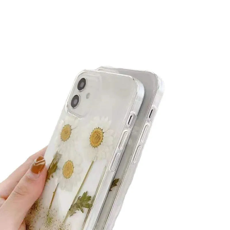 White epoxy daisy floral design on a clear TPU protective case for iPhone models.