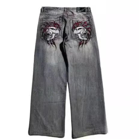 Grey washed-out men's wide-leg jeans with a retro worn look on a mid waist.