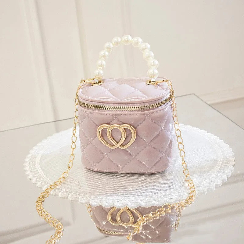 PVC bucket-shaped gel bag for women with a heart pattern, shown in apricot colour.
