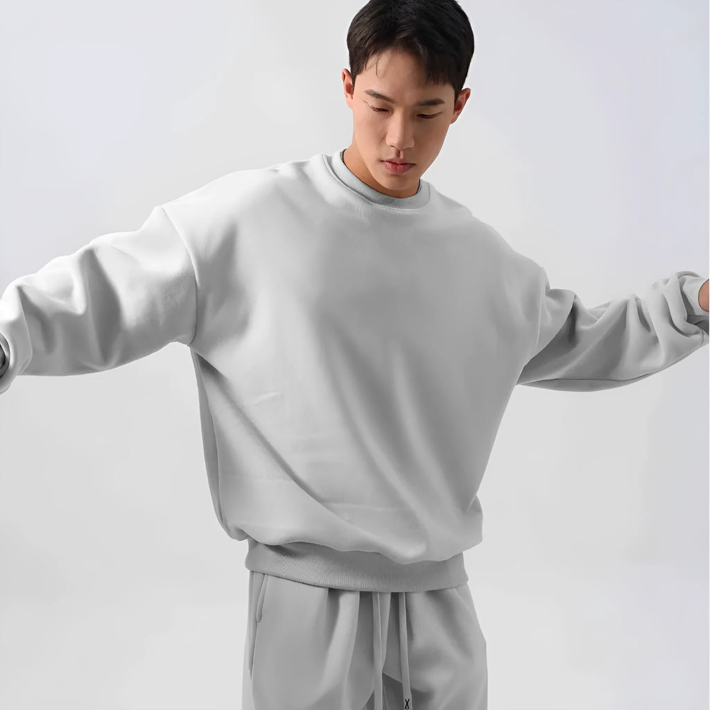 Men's black polar fleece winter sports suit with loose fit long sleeve coat and matching trousers
