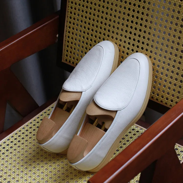 Men's brown genuine leather handmade loafers flat shoes on a white background.