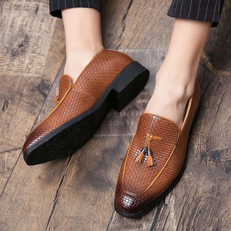 Men's black pointed slip-on business shoes with tassel detail on artificial PU upper