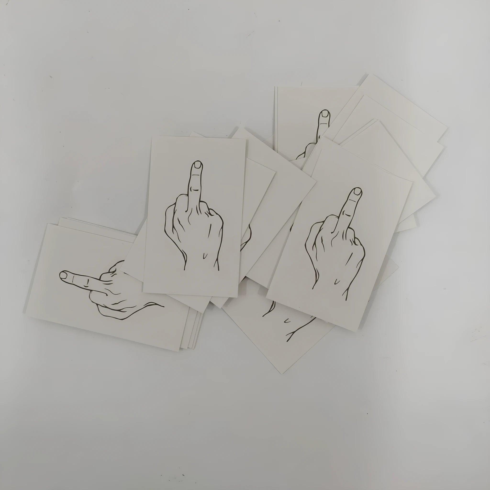 Box of paper illegal parking reminder cards featuring a printed middle finger design.