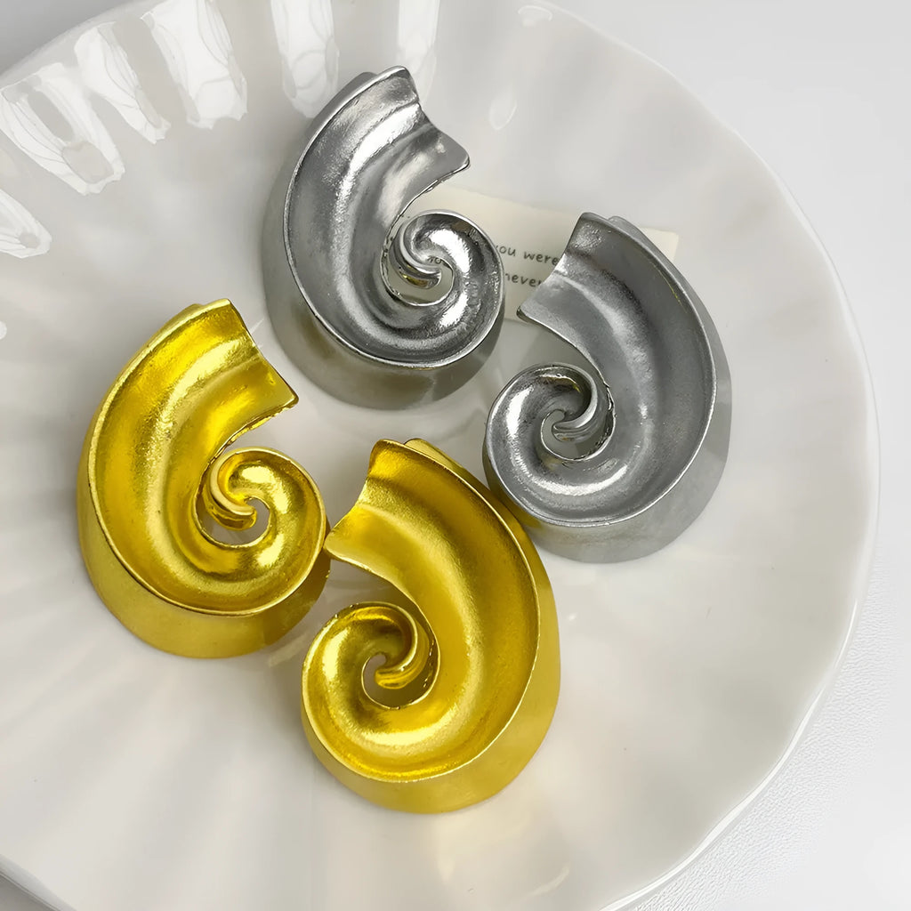 Retro geometric ear studs in gold or silver finish measuring 5cm with alloy construction