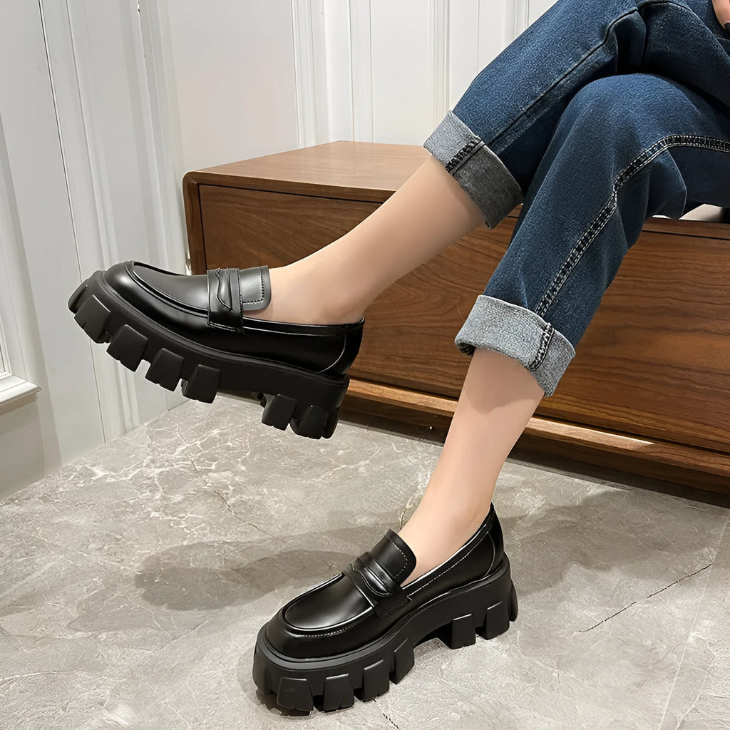 British style wide fit patent leather loafers with a muffin heel and rubber sole.