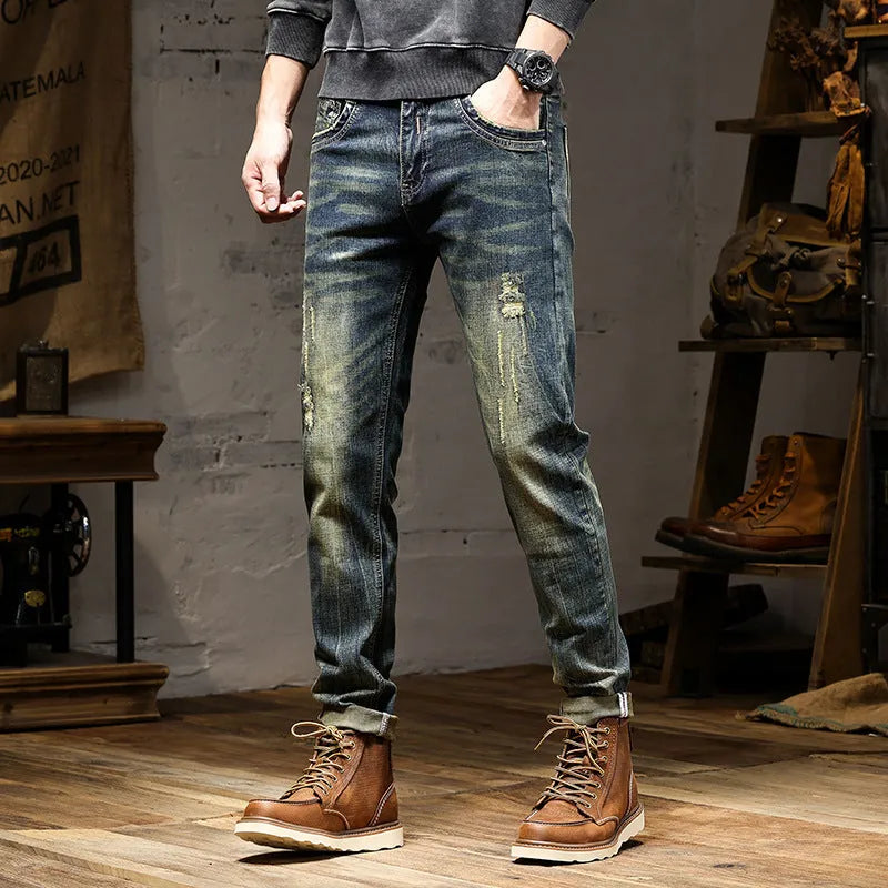 Men's slim-fit retro colour jeans with a zip fly, laid flat to show the skinny pant style.