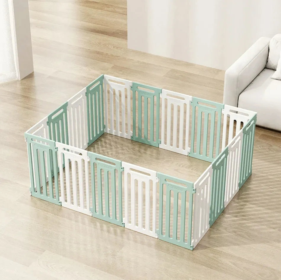 Plastic modular pet isolation fence panels assembled as indoor dog enclosure in white and green colour combination