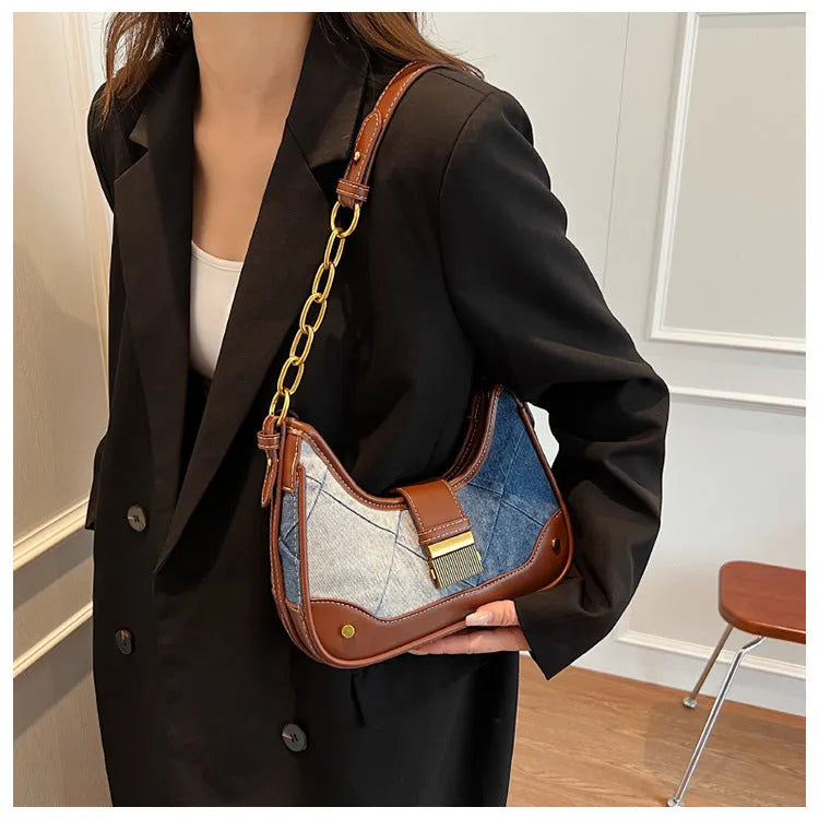 Brown soft denim women's shoulder bag with diamond mesh and chain details, showing bucket shape.