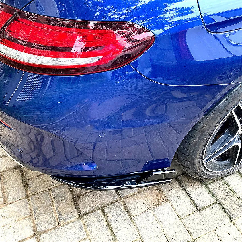 PP plastic car rear corner protectors in piano black and carbon fibre pattern finishes shown as a left and right set