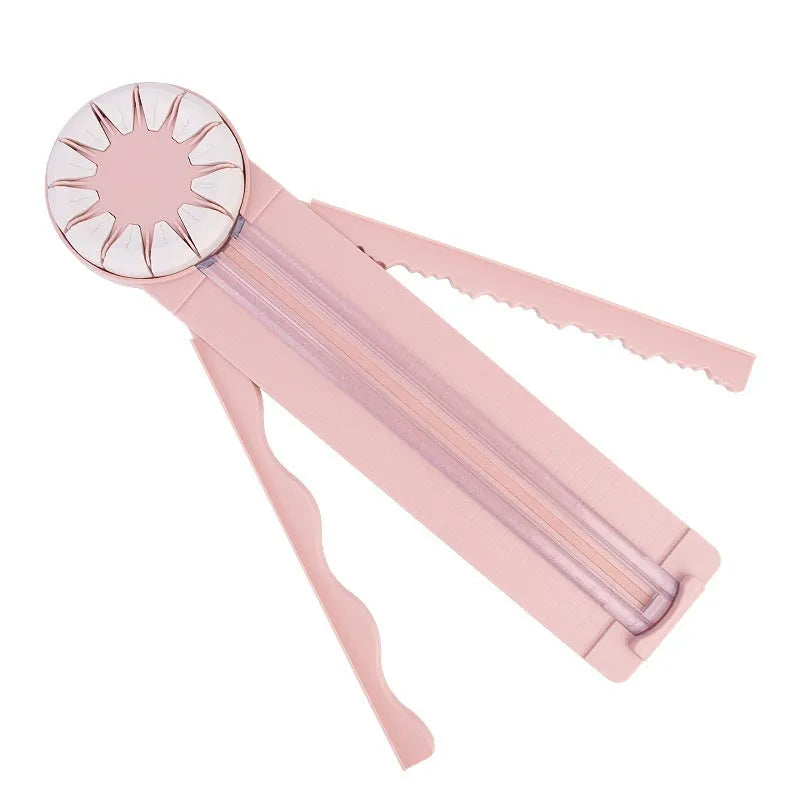 Pink plastic multifunctional 12-in-1 paper cutter and scoring board with size guides.