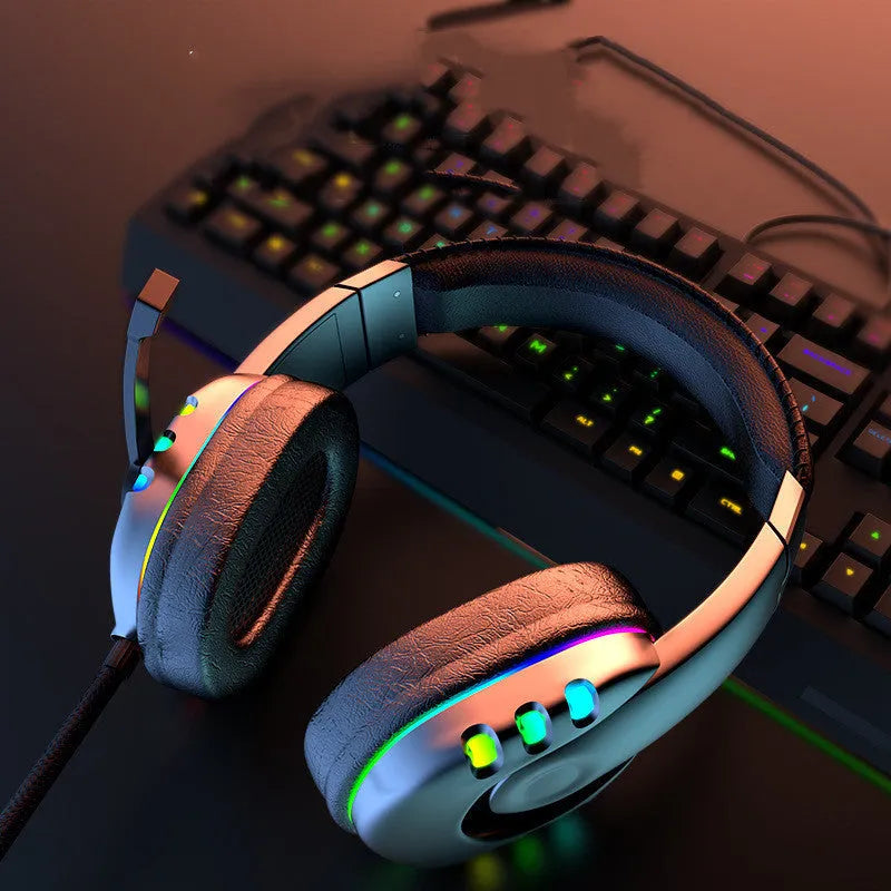 Black Colourful gaming headset with LED breathing light, sponge ear cushions, nylon cable, and omnidirectional microphone on a desk