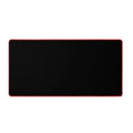Oversized rubber mouse pad 30x60cm with stitched edge in black on a desk