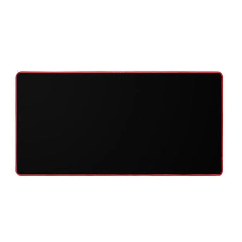 Oversized rubber mouse pad 30x60cm with stitched edge in black on a desk