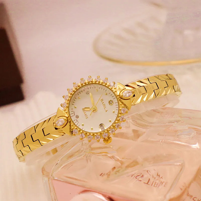Women's quartz watch with diamond-textured metal bracelet and slim 6mm gold-tone case