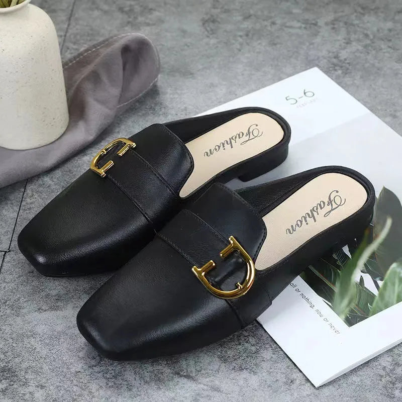 Women's closed toe PVC half slipper in milky white with a double buckle fastening.