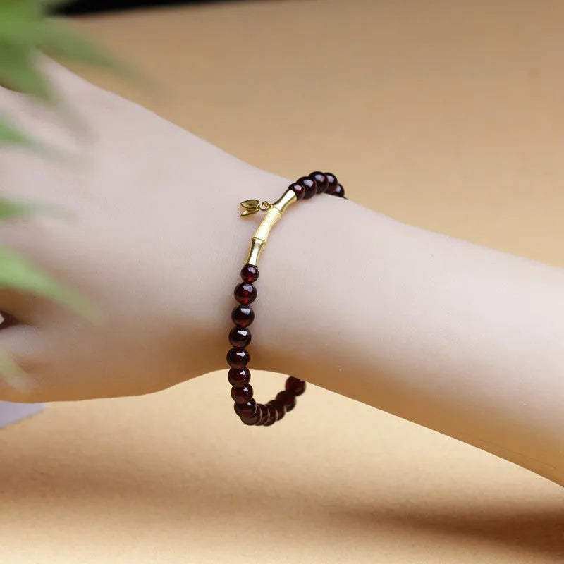 Handmade natural garnet bamboo joint bracelet in copper or silver finish, 6mm bead size.