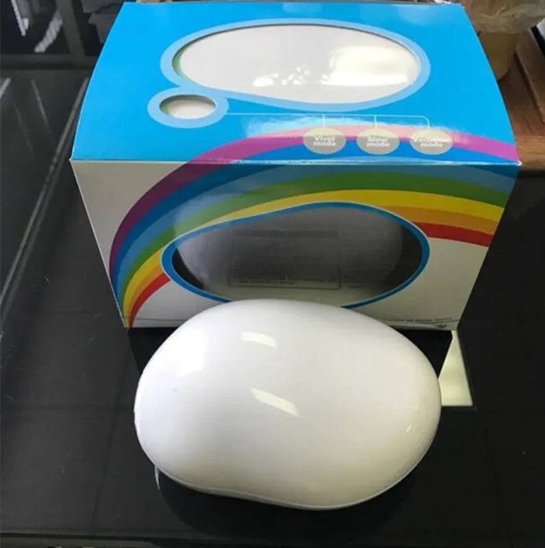 Egg-shaped ABS plastic table lamp, 14 x 10 x 6cm, with rainbow projection, five LED beads, and USB charging