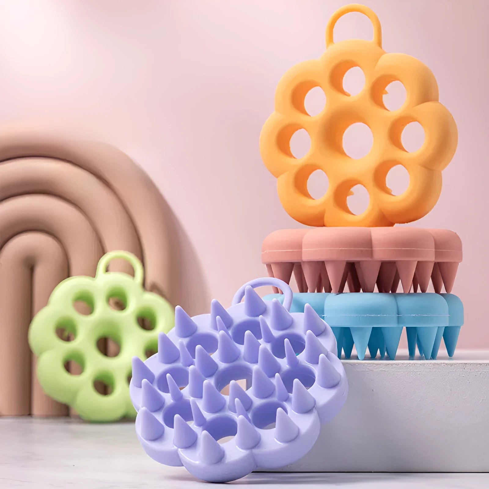 Silicone pet grooming brush with flexible pins and ergonomic handle in assorted colours