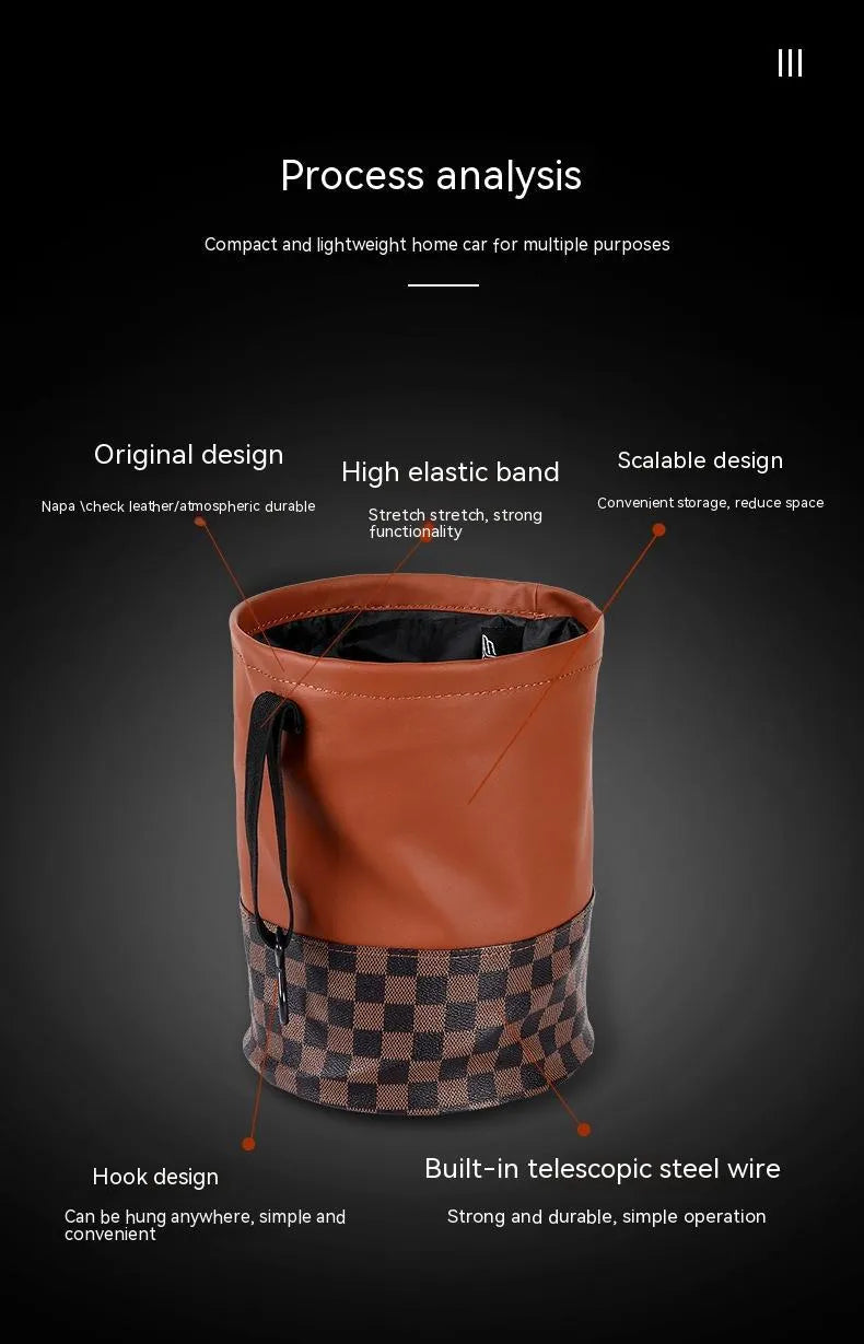 Brown leather retractable car trash can shown in a folded state with a carry handle.