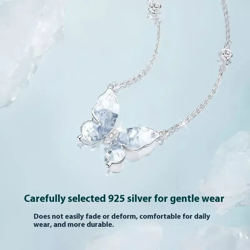 Bingyu adjustable silver butterfly necklace on a dark background, showing the icy electroplated pendant and O-ring chain.