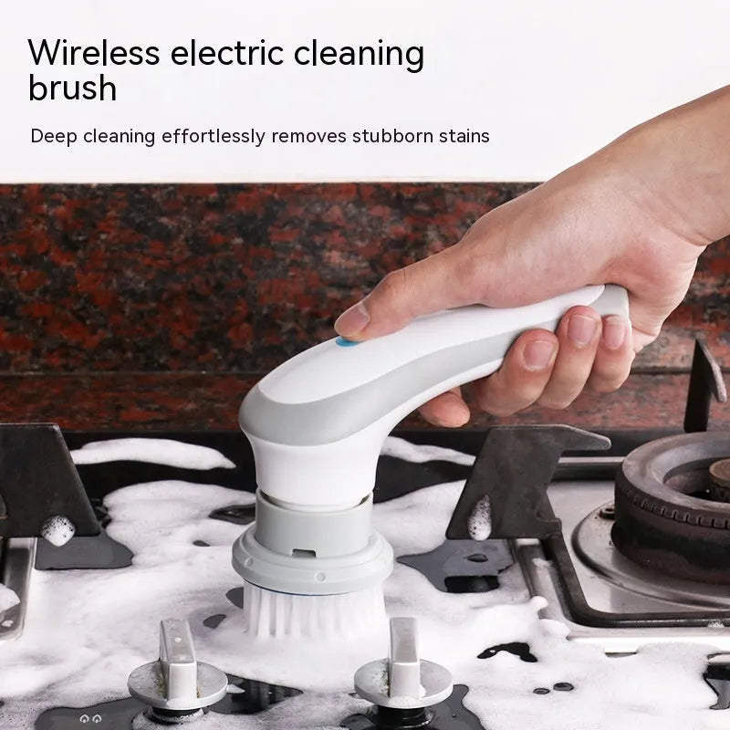 White cordless electric cleaning brush with multiple brush heads on a cleaning surface