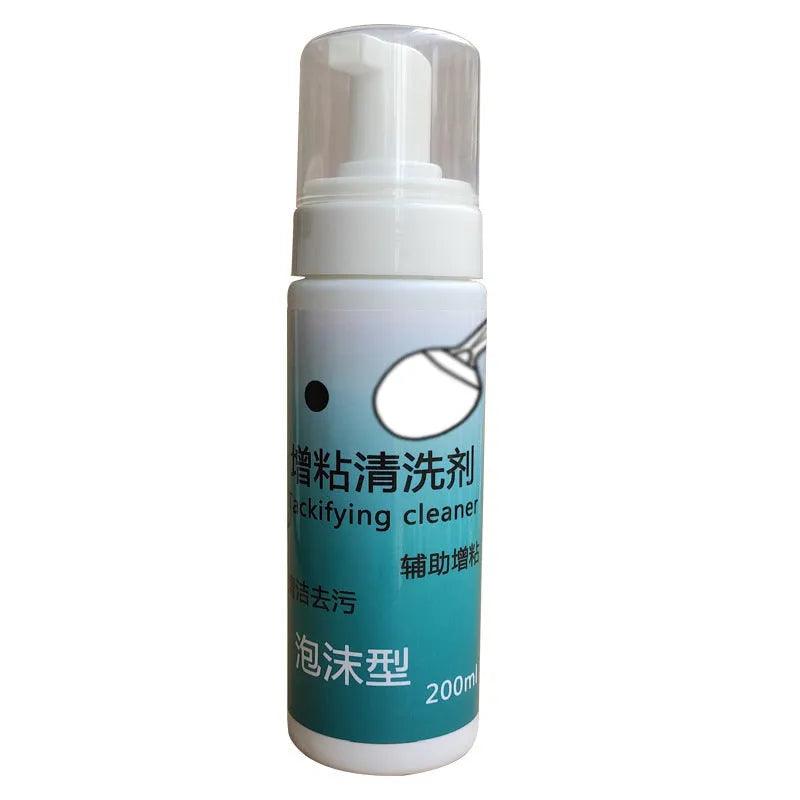 Table tennis racket cleaner kit with sponge mop and 100ml rubber cleaning agent on a court
