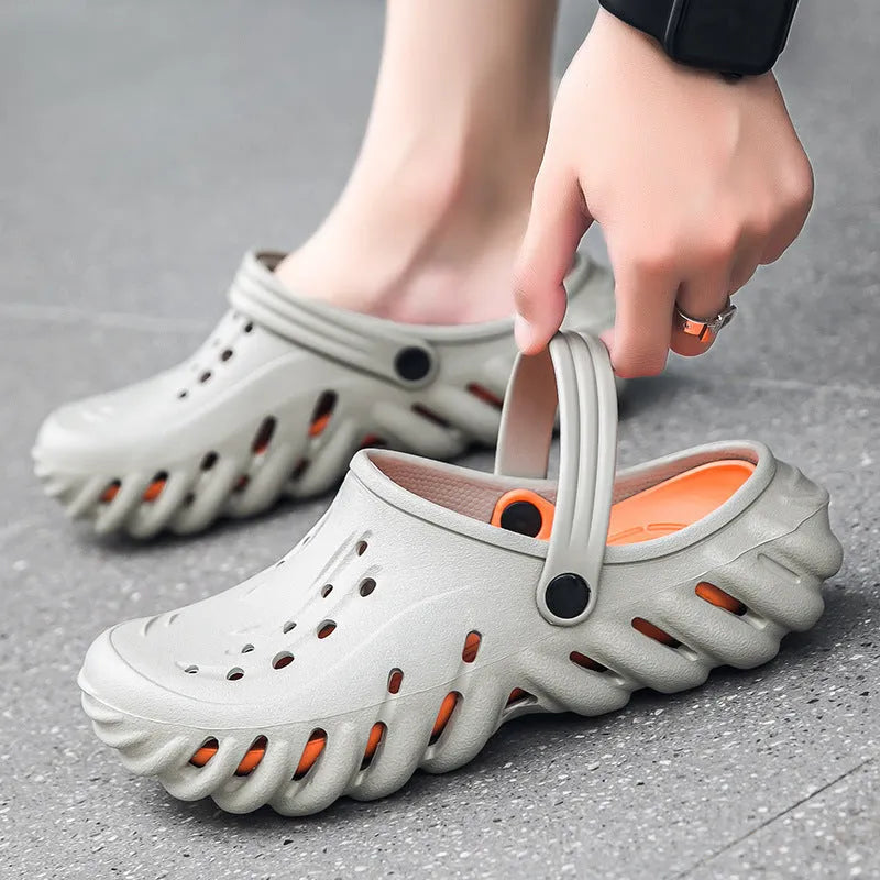 Men's beige EVA slipper sandals with hollow-out pattern and non-slip sole.