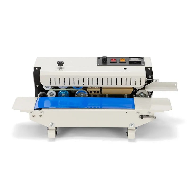 Mini benchtop heat sealing machine with steel jaw and integrated date print function on a work surface.