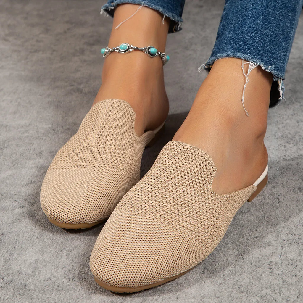 Mesh sandals with cloth upper and rubber sole in apricot colour, showing round toe slip-on design